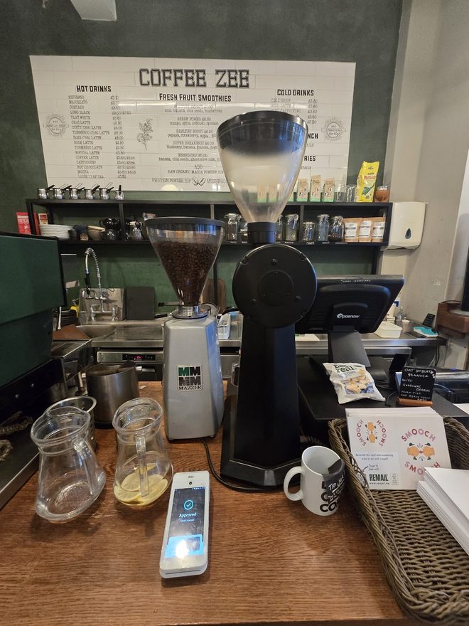 Grinder, carafes and scales at the barista station