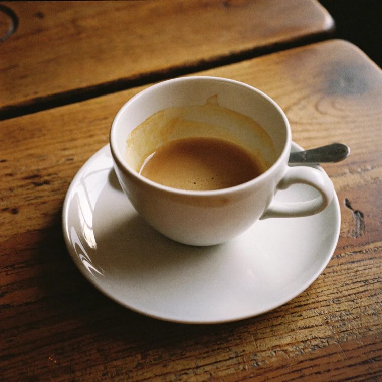 A flat white in a ceramic cup and saucer